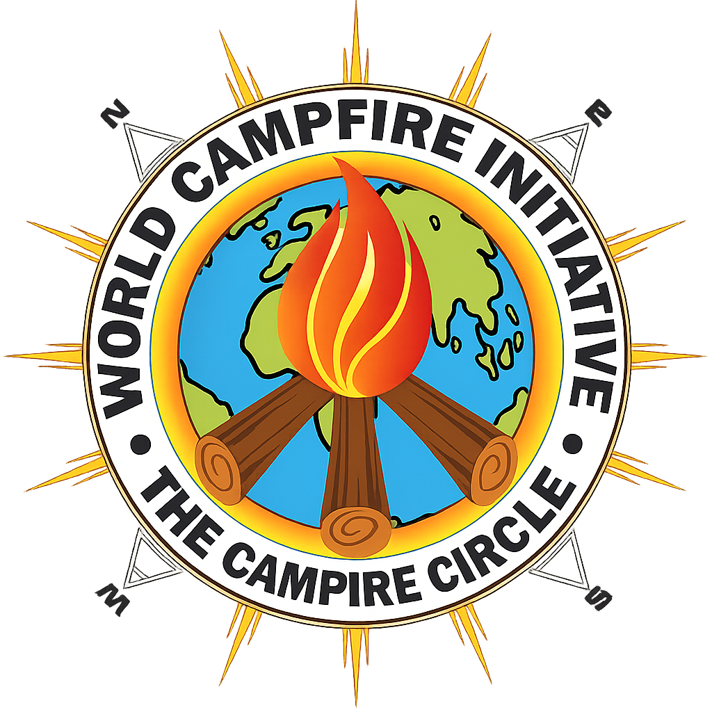 The Campfire Circle Global Meditation 4 | Galactic Federation of Light | The Campfire Circle Circular emblem logo for the World Campfire Initiative and The Campfire Circle founded by Trevor One Feather (Trevor Reichert) featuring three wooden logs arranged beneath a bright orange-gold flame, subtly forming a peace-sign shape within a circular sun-ring over a blue and green Earth globe. The globe is encircled by a golden ring and a white outer band with bold black lettering reading “WORLD CAMPFIRE INITIATIVE” at the top and “THE CAMPFIRE CIRCLE” at the bottom. Golden sunburst rays extend outward from behind the circle, symbolizing radiance, unity, and global coherence. Subtle directional markers (N, E, S, W) appear around the outer edge, reinforcing worldwide scope and a unified global mass meditation field.